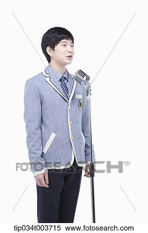 Stock Photography - a male student making a speech through a microphone . Fotosearch