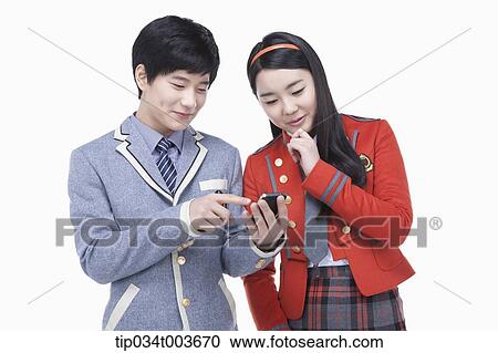 a male student showing his mobile phone to a female student View Large Photo Image Stock Image - a male student showing his mobile phone to a female student. Fotosearch