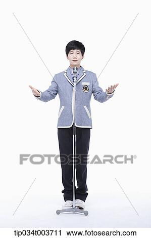a male student standing with his arms open View Large Photo Image Stock Image - a male student standing with his arms open . Fotosearch