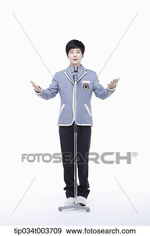 Stock Photo - a male student standing with his arms open . Fotosearch