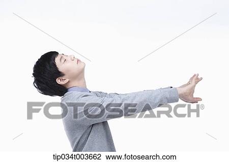 a male student stretching his neck and arms View Large Photo Image Stock Image - a male student stretching his neck and arms. Fotosearch