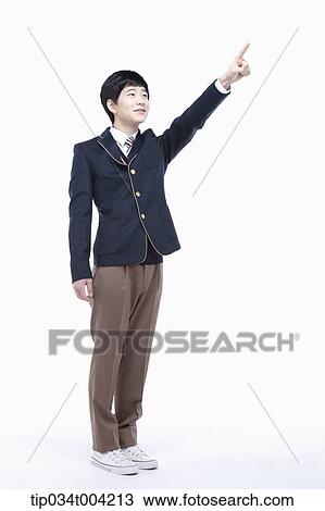 a male student wearing school uniform pointing View Large Photo Image Stock Image - a male student wearing school uniform pointing. Fotosearch