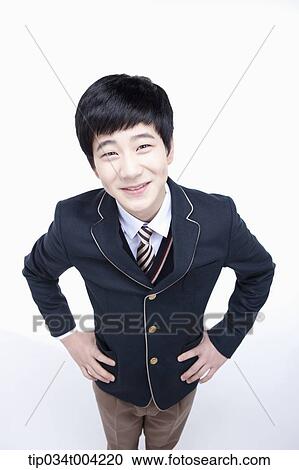 a male student wearing school uniform looking up under camera View Large Photo Image Stock Image - a male student wearing school uniform looking up under camera . Fotosearch