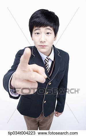 a male student wearing school uniform pointing at camera View Large Photo Image Stock Image - a male student wearing school uniform pointing at camera. Fotosearch