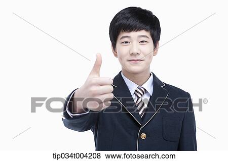 a male student wearing school uniform standing with thumbs up View Large Photo Image Stock Photo - a male student wearing school uniform standing with thumbs up. Fotosearch