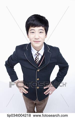 a male student wearing school uniform looking up under camera View Large Photo Image Stock Photo - a male student wearing school uniform looking up under camera . Fotosearch