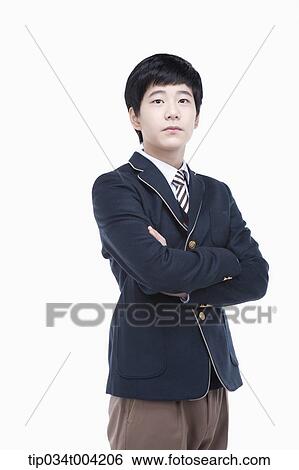 a male student wearing school uniform standing with arms crossed View Large Photo Image Stock Photograph - a male student wearing school uniform standing with arms crossed . Fotosearch