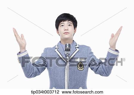 Stock Image - a male student with his arms open . Fotosearch
