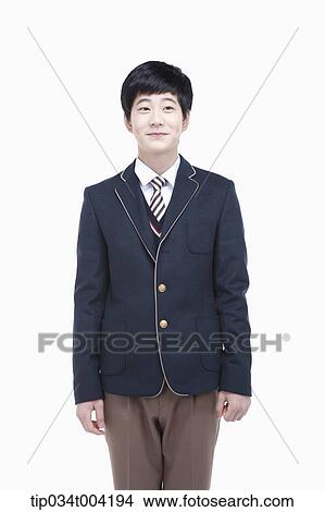 a male student with school uniform standing up straight View Large Photo Image Picture - a male student with school uniform standing up straight. Fotosearch