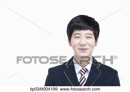 Stock Photo - a male student with school uniform smiling . Fotosearch