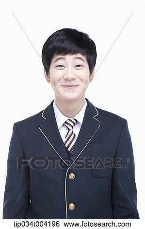 Stock Photograph - a male student with school uniform smiling . Fotosearch