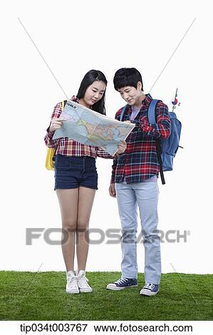 a man and a woman looking at map together View Large Photo Image Stock Photo - a man and a woman looking at map together. Fotosearch