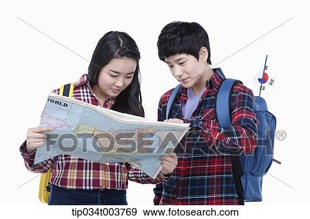 a man and a woman wearing check shirt looking at a map together View Large Photo Image Stock Photo - a man and a woman wearing check shirt looking at a map together. Fotosearch