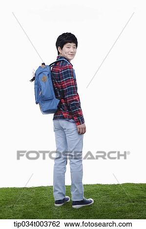 a man looking behind wearing a backpack View Large Photo Image Stock Image - a man looking behind wearing a backpack. Fotosearch