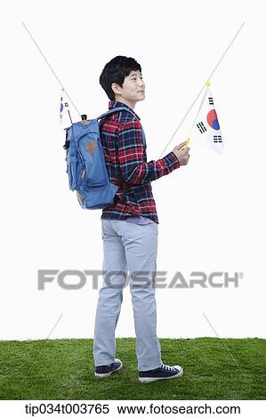 a man with a backpack holding a Korean flag View Large Photo Image Stock Photography - a man with a backpack holding a Korean flag. Fotosearch