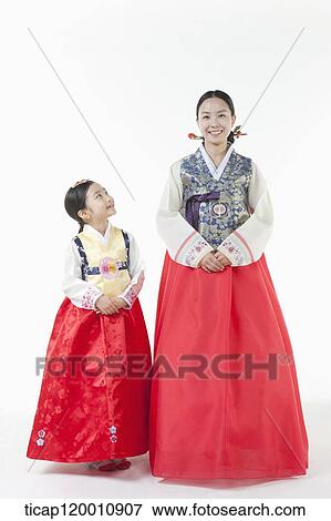 a mother and a daughter standing in a line wearing Hanbok View Large Photo Image Stock Photo - a mother and a daughter standing in a line wearing Hanbok. Fotosearch