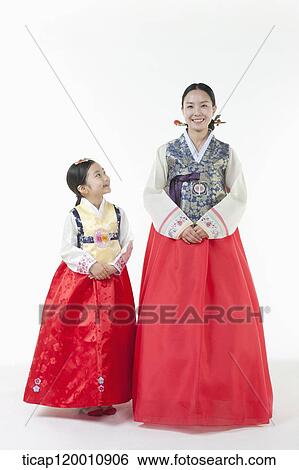 a mother and a daughter standing in a line wearing Hanbok View Large Photo Image Stock Photograph - a mother and a daughter standing in a line wearing Hanbok. Fotosearch