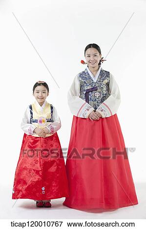 Stock Photo - a mother and a daughter wearing Hanbok dress. Fotosearch