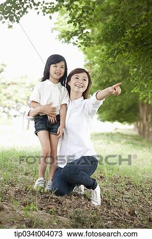 a mother pointing somewhere View Large Photo Image Stock Image - a mother pointing somewhere . Fotosearch