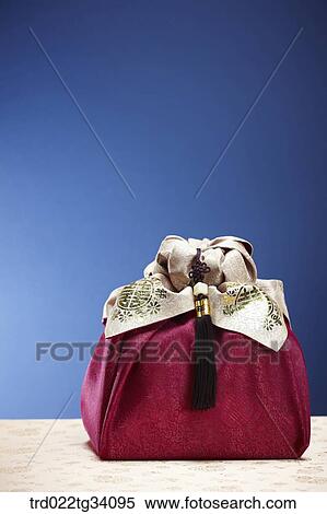 a package in a red Korean traditional wrap View Large Photo Image Stock Photography - a package in a red Korean traditional wrap . Fotosearch