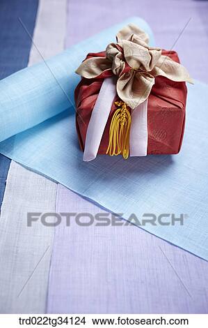 Picture - a package in Korean traditional wrap on hanji . Fotosearch