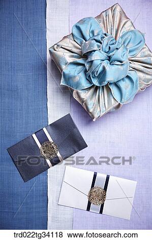 Stock Photo - a package in Korean traditional wrap on traditional cloth. Fotosearch