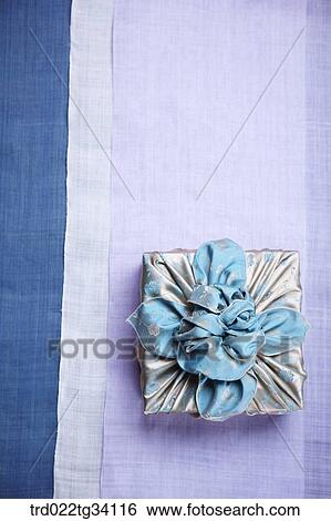 Stock Photograph - a package in Korean traditional wrap on traditional cloth. Fotosearch
