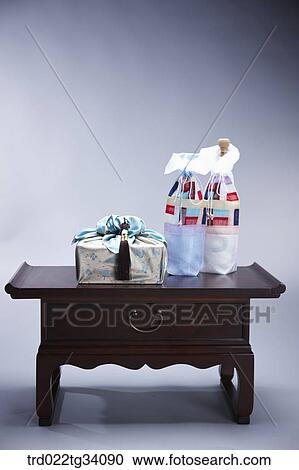 a package in Korean traditional wrap and bottle covers on traditional table View Large Photo Image Stock Image - a package in Korean traditional wrap and bottle covers on traditional table. Fotosearch