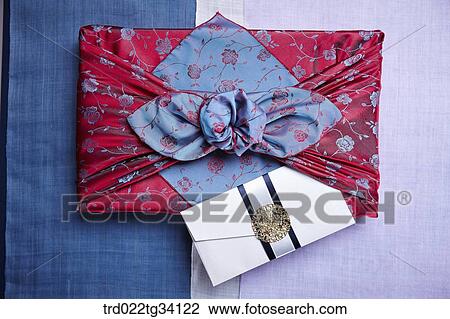 a package in Korean traditional wrap and an envelope on traditional cloth View Large Photo Image Stock Image - a package in Korean traditional wrap and an envelope on traditional cloth. Fotosearch