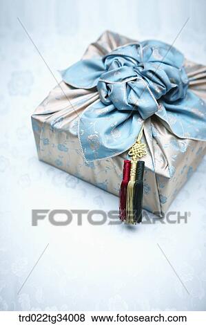 a package wrapped in a blue traditional wrap View Large Photo Image Stock Photo - a package wrapped in a blue traditional wrap . Fotosearch