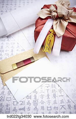 Stock Image - a package wrapped in a traditional wrap between a envelope and traditional paper. Fotosearch