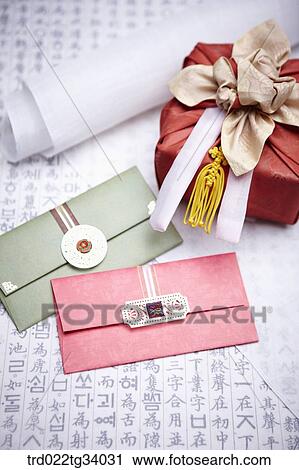 Stock Image - a package wrapped in a traditional wrap between a envelope and traditional paper. Fotosearch