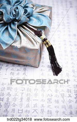a package wrapped in a traditional wrap with nice big ribbon View Large Photo Image Stock Photo - a package wrapped in a traditional wrap with nice big ribbon . Fotosearch