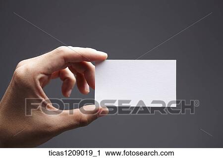 a piece of paper in hand View Large Photo Image Stock Image - a piece of paper in hand. Fotosearch