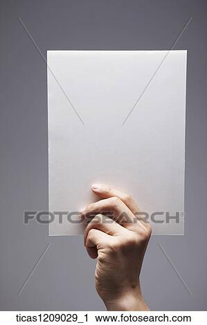 a piece of paper in hand View Large Photo Image Stock Image - a piece of paper in hand. Fotosearch