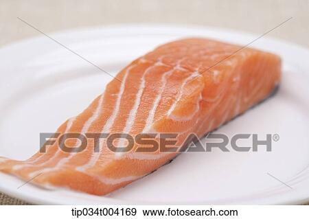 Stock Photo - a plate of raw fresh salmon. Fotosearch