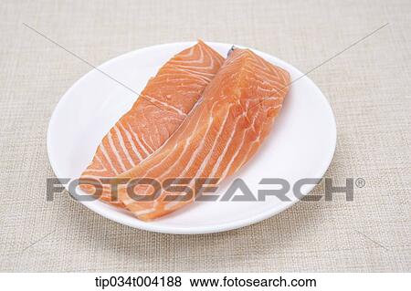 a plate of raw fresh salmon View Large Photo Image Stock Photo - a plate of raw fresh salmon. Fotosearch