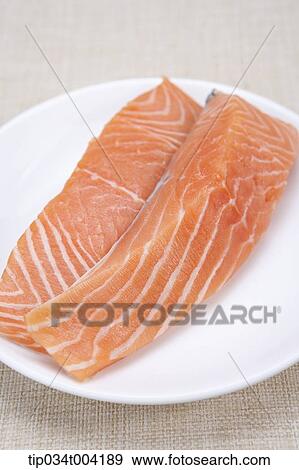 a plate of raw fresh salmon View Large Photo Image Stock Photo - a plate of raw fresh salmon. Fotosearch