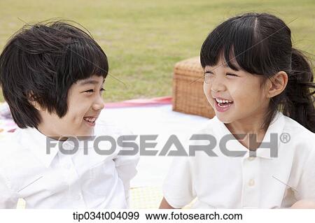 a son and a daughter with a picnic basket behind View Large Photo Image Stock Photo - a son and a daughter with a picnic basket behind. Fotosearch