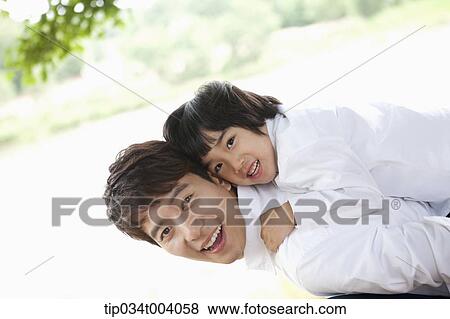 a son on father's back View Large Photo Image Stock Photo - a son on father's back . Fotosearch
