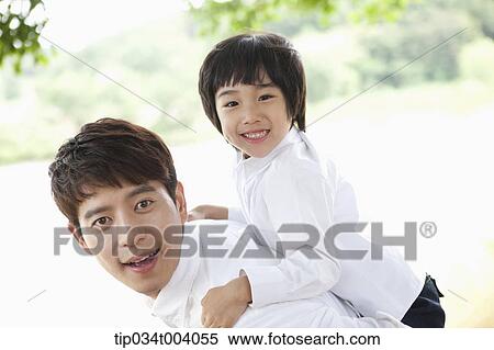 a son on father's back View Large Photo Image Stock Photography - a son on father's back . Fotosearch