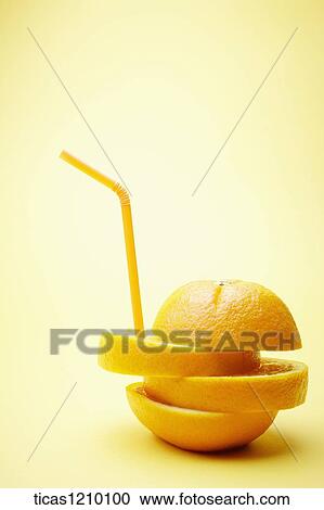 a straw on cut orange View Large Photo Image Stock Image - a straw on cut orange. Fotosearch