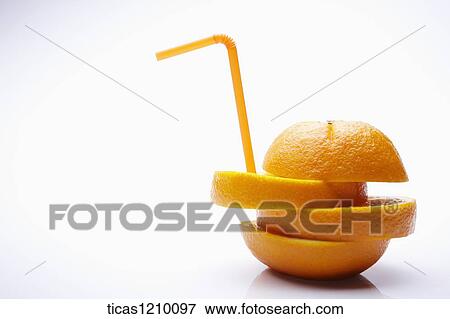 a straw on cut orange View Large Photo Image Stock Photo - a straw on cut orange. Fotosearch