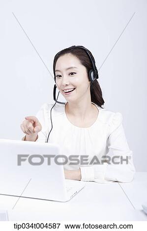 a telemarketer talking while pointing View Large Photo Image Stock Photo - a telemarketer talking while pointing. Fotosearch