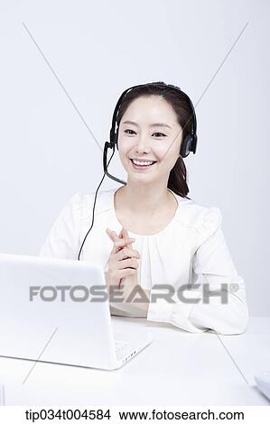 a telemarketer talking with hands together View Large Photo Image Picture - a telemarketer talking with hands together. Fotosearch