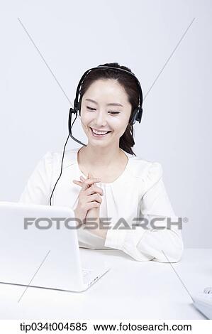 Stock Photography - a telemarketer with hands together. Fotosearch