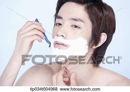 Stock Photo - a topless man shaving. Fotosearch