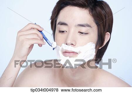 Stock Photo - a topless man shaving. Fotosearch