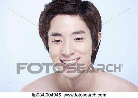 Stock Photography - a topless man smiling. Fotosearch