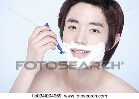 a topless man smiling while shaving View Large Photo Image Stock Photo - a topless man smiling while shaving. Fotosearch